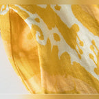 Tecido em linho amarelo com estampado branco das calças Liora Pant – detalhe do material