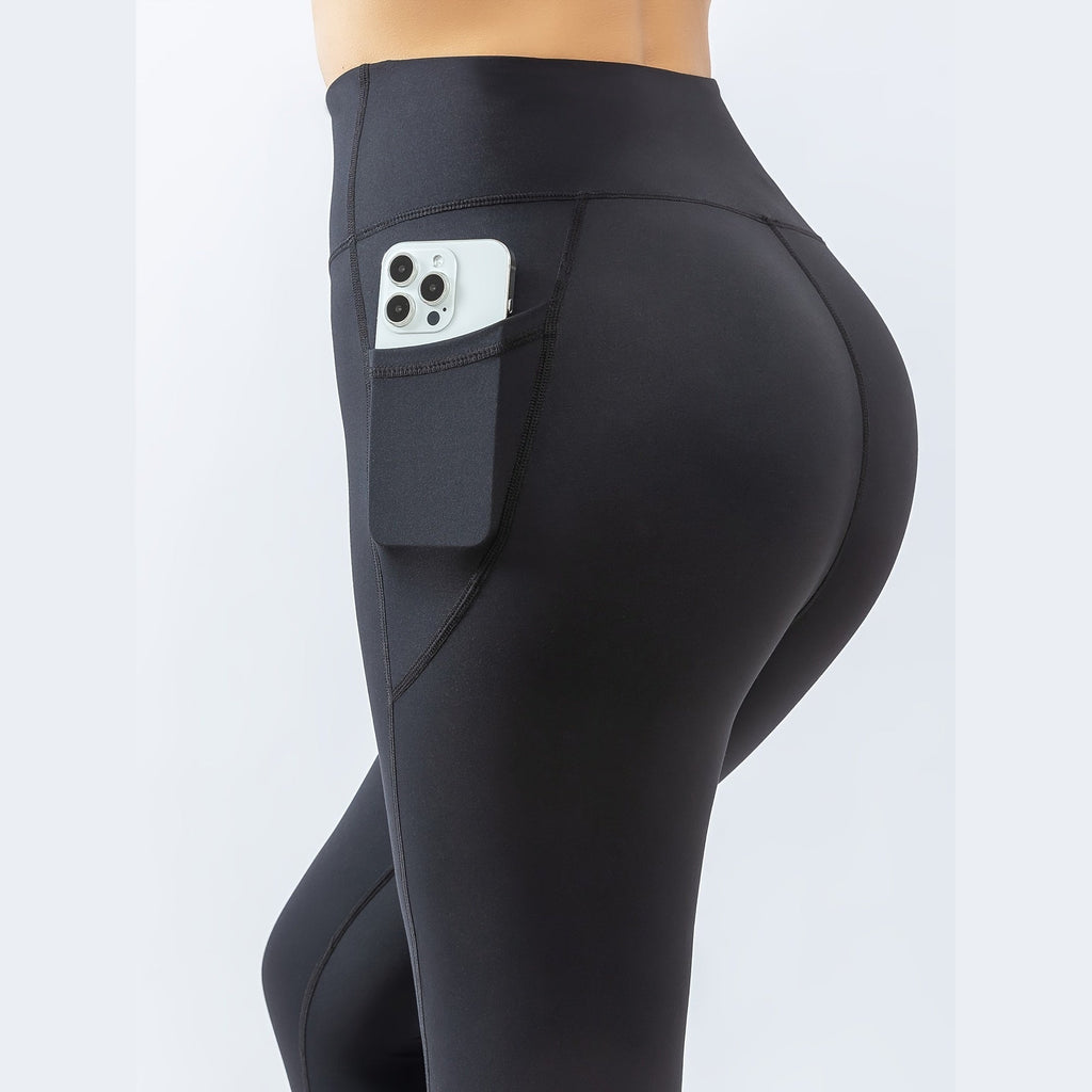 Leggings Prithvi Pants pretas com bolso para telemóvel – vista de costas