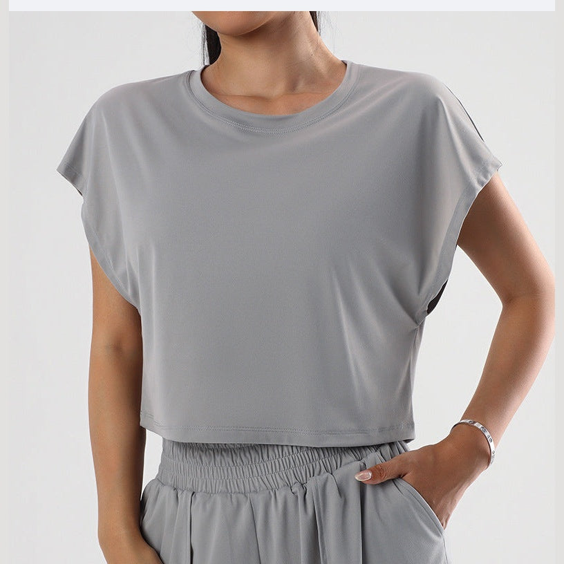 Top desportivo curto Atma Dry cinzento de manga caída – vista de frente