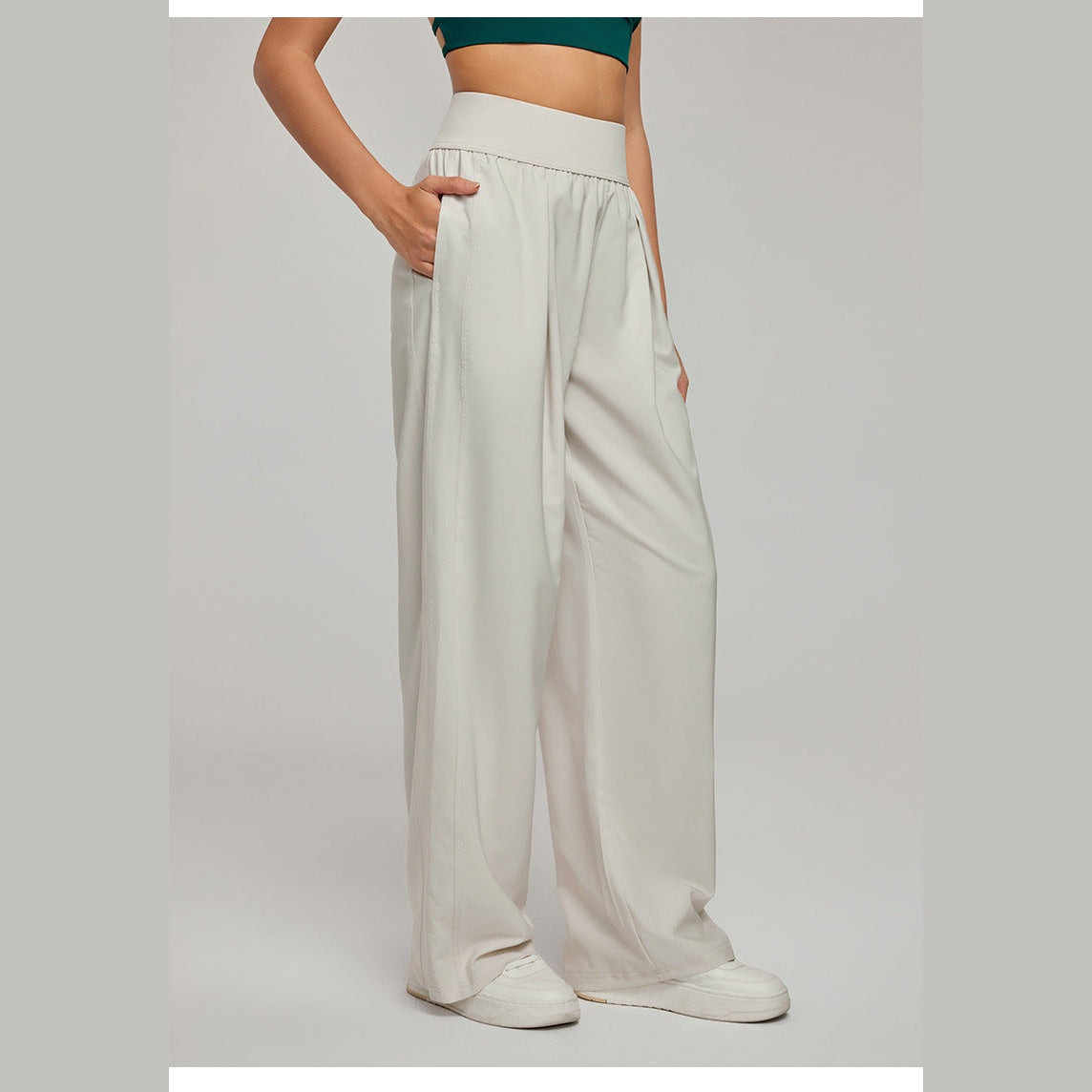 Calças casuais de perna larga bege-claras com bolsos – vista lateral