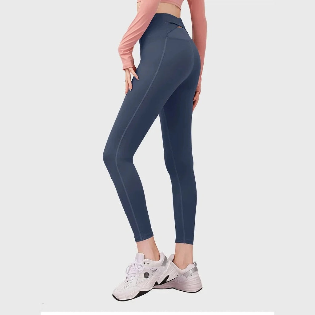 Leggings Anahata Cross azul-escuras de cintura alta – vista de frente