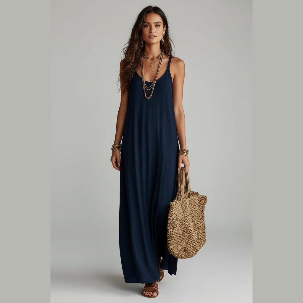 Vestido Ananda Breeze azul-marinho comprido de alças com mala de palha – vista de frente