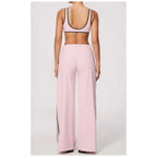 Conjunto Shakti Line rosa-água com top e calças de perna larga – vista de costas