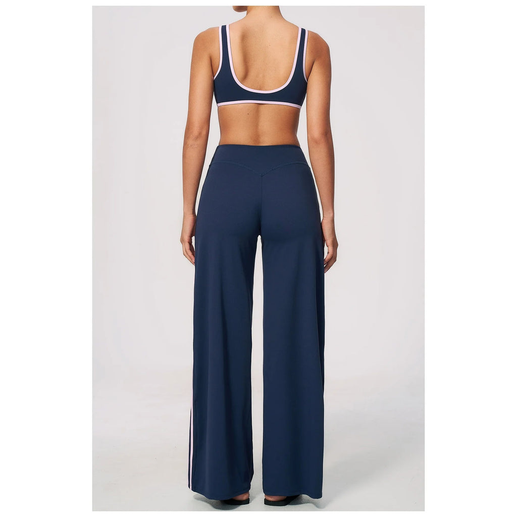 Conjunto Shakti Line azul-escuro e rosa com top e calças – vista de frente