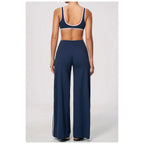 Conjunto Shakti Line azul-escuro e rosa com top e calças – vista de frente