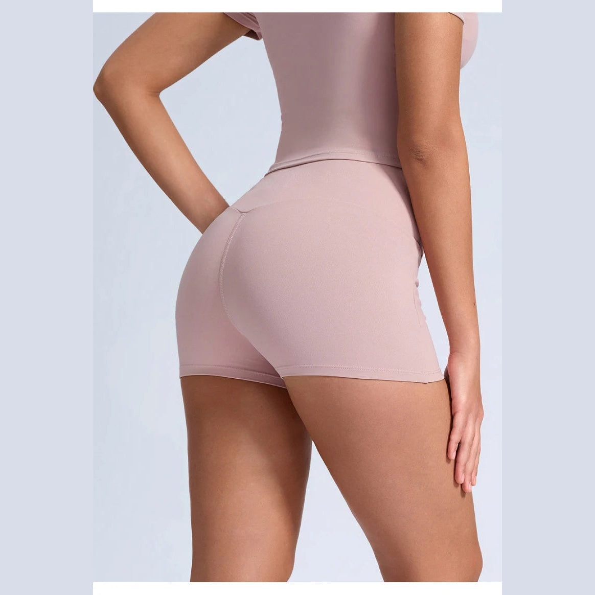 Calções Shakti Move rosa-acinzentados de cintura cruzada – vista lateral de costas