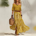 Conjunto feminino boho de top com mangas bufantes e saia comprida às riscas – fotografia 21