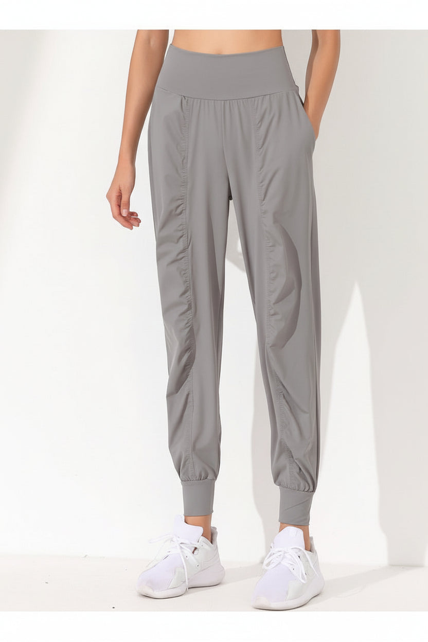 Pantalones de yoga sueltos y moldeadores para mujer - Secado rápido, bajo plisado y bolsillos laterales