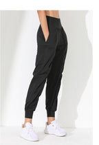 Pantalones de yoga sueltos y moldeadores para mujer - Secado rápido, bajo plisado y bolsillos laterales