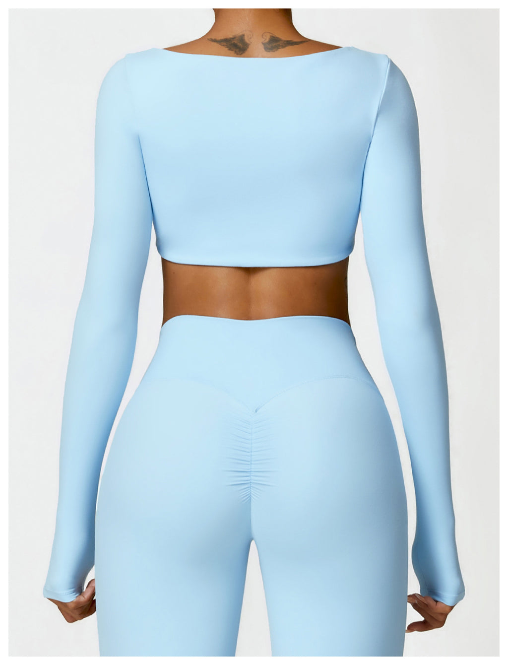 Sutra Fit – Blusa de rendimiento con diseño femenino para movimiento y confort