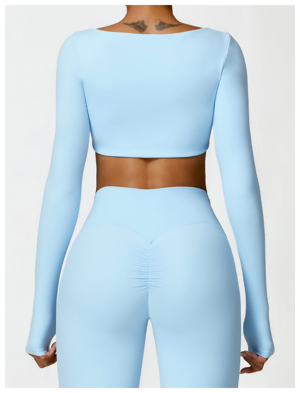 Sutra Fit – Blusa de rendimiento con diseño femenino para movimiento y confort