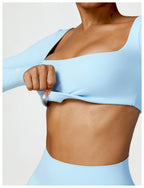 Sutra Fit – Blusa de rendimiento con diseño femenino para movimiento y confort