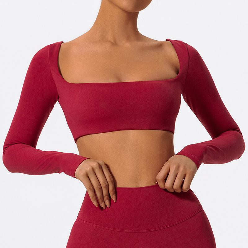 Sutra Fit – Blusa de rendimiento con diseño femenino para movimiento y confort
