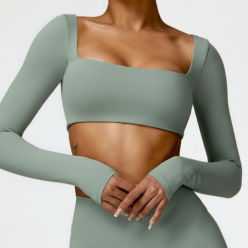 Sutra Fit – Blusa de rendimiento con diseño femenino para movimiento y confort