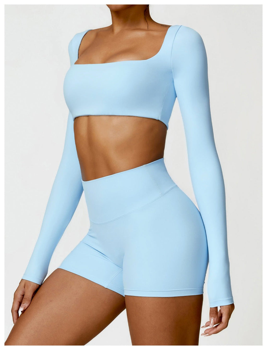 Sutra Fit – Blusa de rendimiento con diseño femenino para movimiento y confort