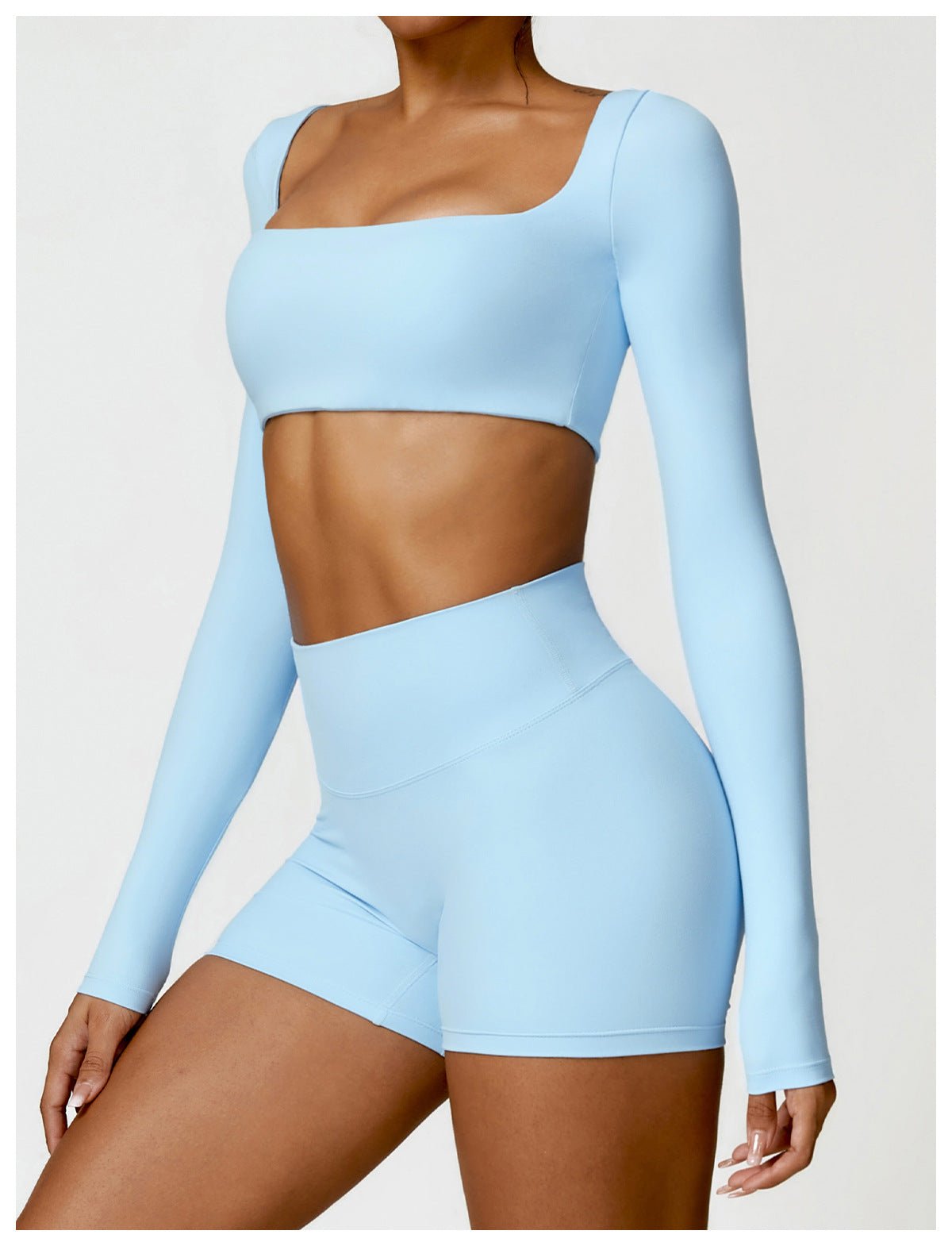 Sutra Fit – Blusa de rendimiento con diseño femenino para movimiento y confort
