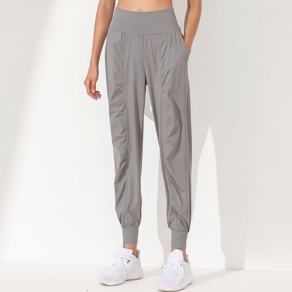 Calça de Yoga Feminina Solta e Modeladora – Secagem Rápida, Barra Plissada e Bolsos Laterais – capa