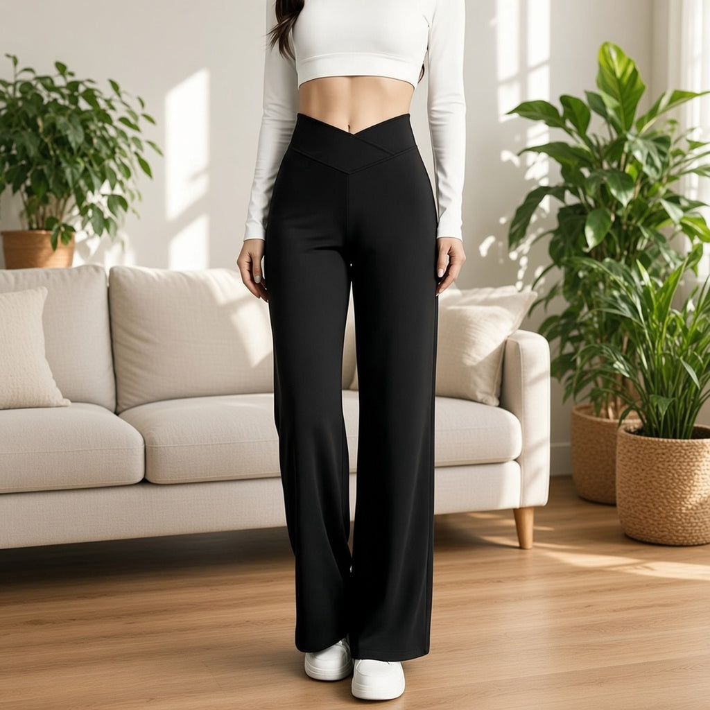 Calças wide leg Prana Move pretas com cintura cruzada em V numa sala de estar luminosa