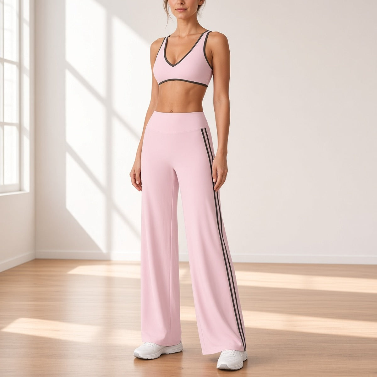 Conjunto Shakti Line rosa com calças wide leg num estúdio de pilates