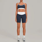 Conjunto de yoga Nuhra Contrast da Shamar azul-marinho com contraste branco