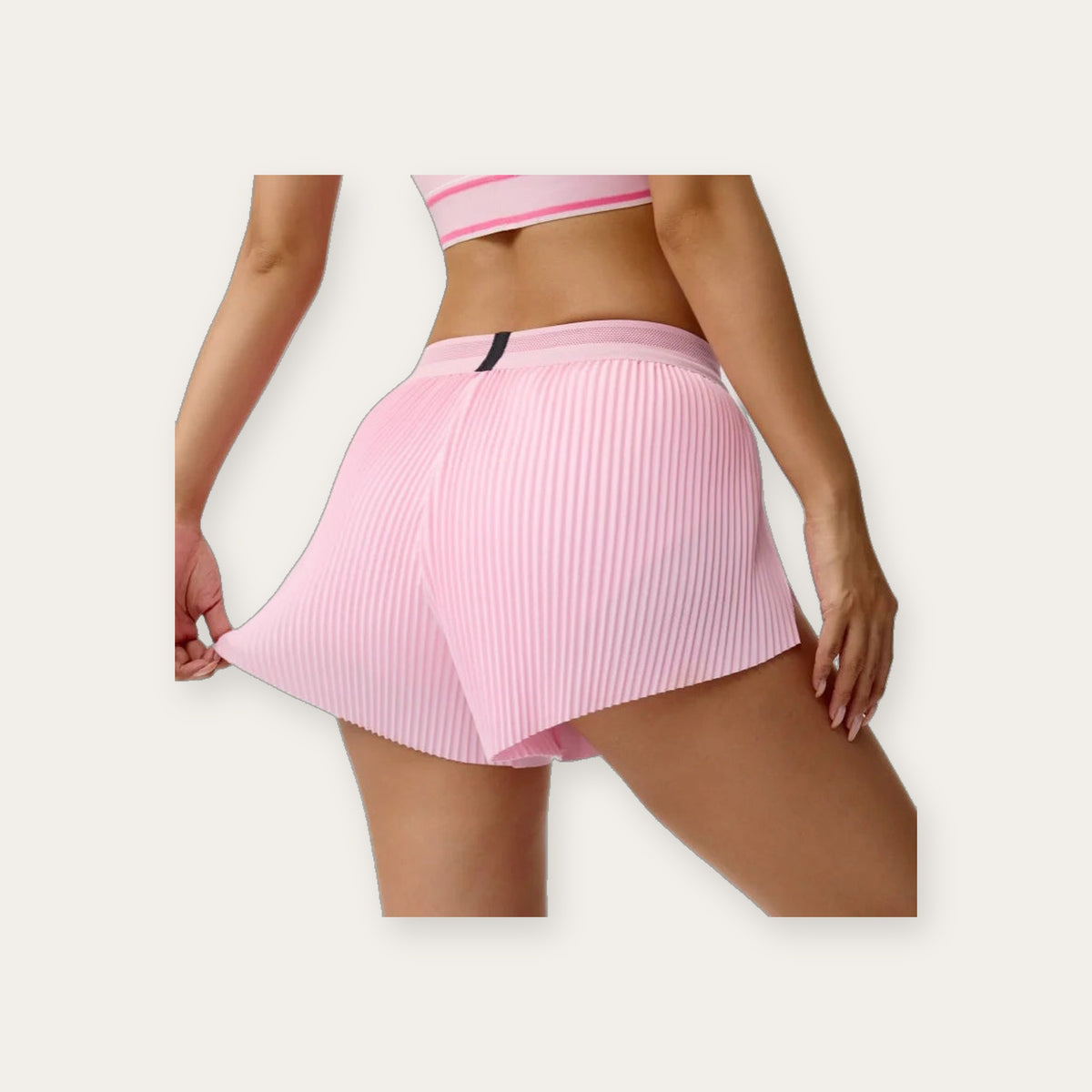 Idun Bloom – Calções plissados rosa vista de costas